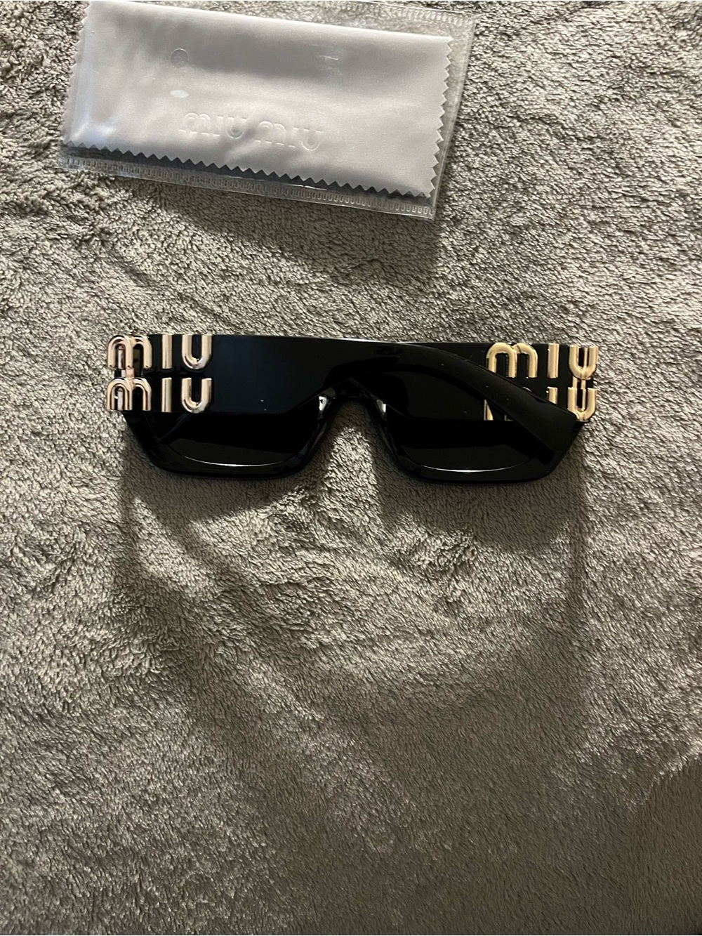 Miu Miu Black Sunglasses with Gold Logo Accents